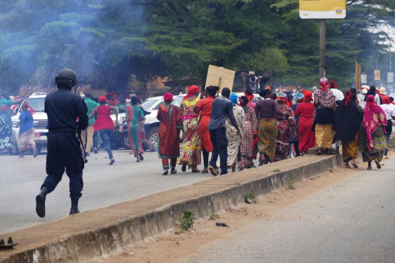 Police use teargas to disperse women protesters during a demonstration against a series of bloody crackdowns on opposition demonstrations, in Conakry, Guinea, 13 November 2018, CELLOU BINANI/AFP/Getty Images