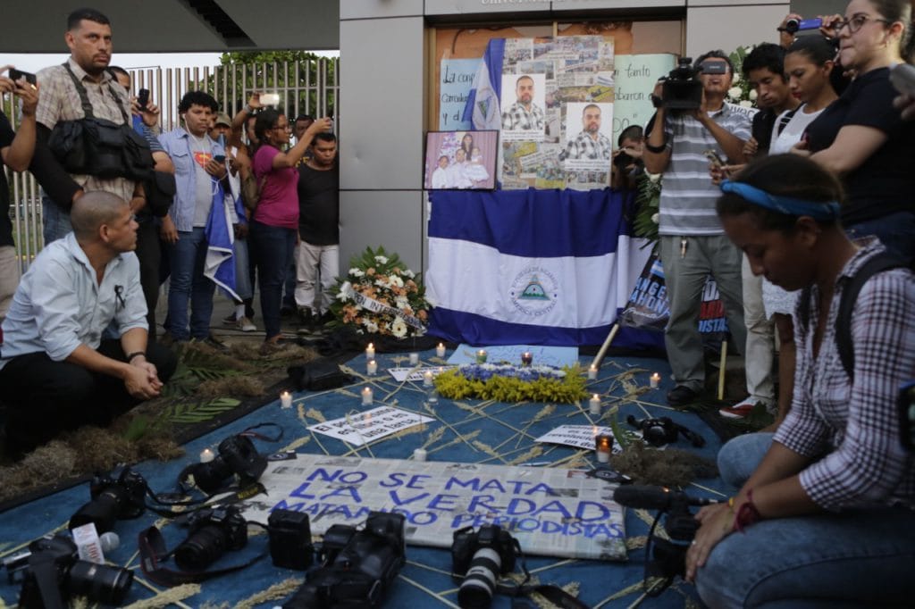 Students and journalists protest in memory of murdered journalist Ángel Eduardo Gahona in front of the Universidad Centroamericana (UCA) in Managua, Nicaragua, 26 April 2018, INTI OCON/AFP/Getty Images