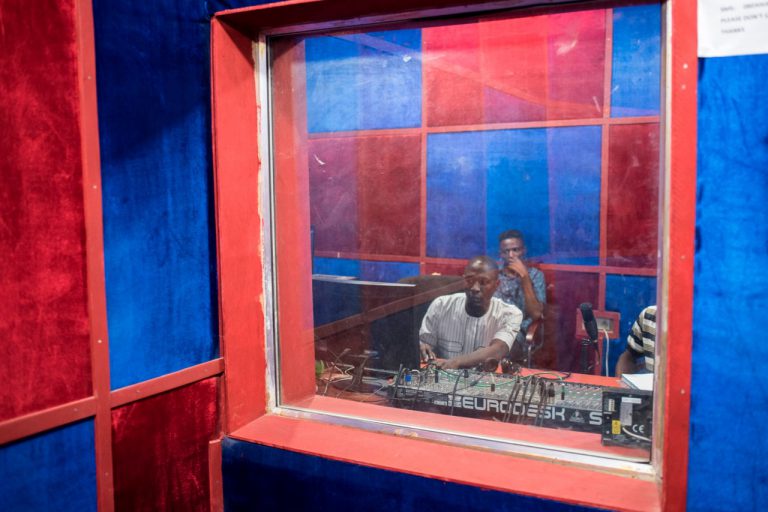 A sound engineer and a presentor take part in a live broadcast at a radio station, in Maiduguri, Nigeria, 4 July 2017, STEFAN HEUNIS/AFP/Getty Images