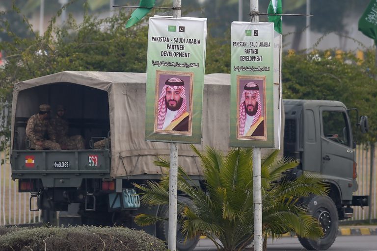 Soldiers patrol on a street next to posters welcoming Saudi Arabian Crown Prince Mohammed bin Salman in Islamabad, Pakistan, 17 February 2019, AAMIR QURESHI/AFP/Getty Images