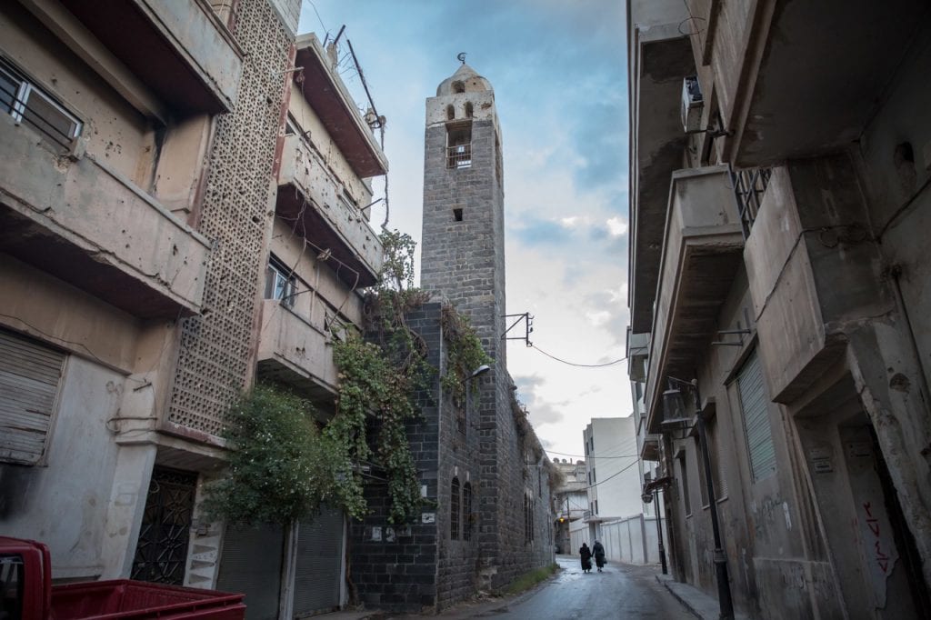 Women walk through a street in Homs, Syria, 31 October 2017, Sally Hayden/SOPA Images/LightRocket via Getty Images