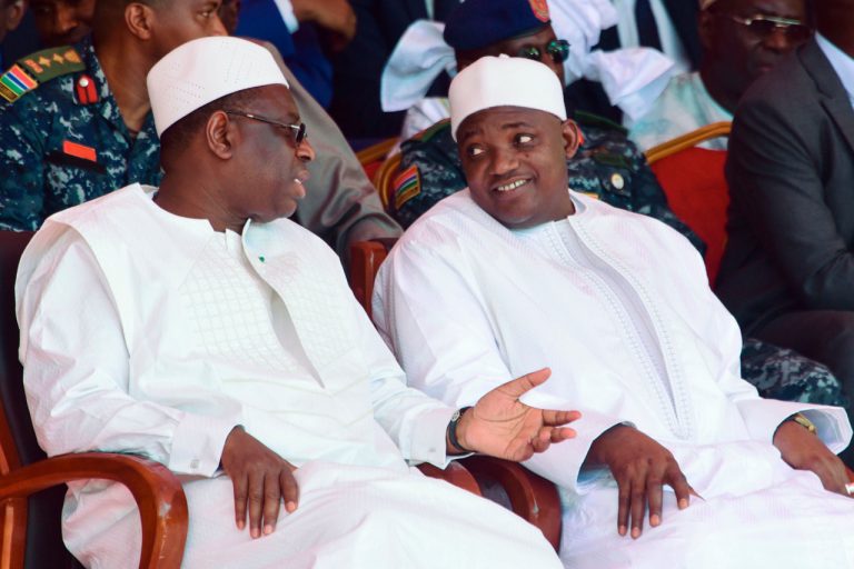 Senegal's president Macky Sall (L) and The Gambia's President Adama Barrow (R) talk as they take part in the inauguration of a bridge in Farafenni, The Gambia, 21 January 2019, SEYLLOU/AFP/Getty Images