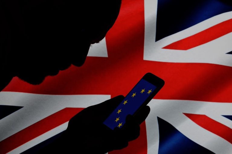 Part of an EU flag is displayed on a smartphone with the Union Jack in the background in this photo illustration, 15 November 2017, Jaap Arriens/NurPhoto via Getty Images