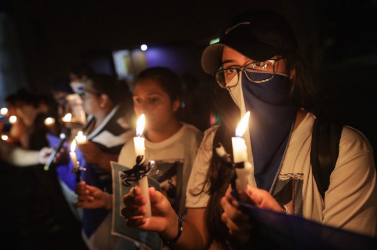 Anti-government demonstrators take part in a vigil to demand the release of political prisoners and justice for the victims of protests against President Daniel Ortega, in Managua, Nicaragua, 3 October 2019, INTI OCON/AFP via Getty Images