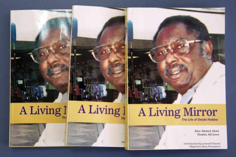 The cover of a book on the life of prominent Gambian journalist Deyda Hydara slain in 2004, is displayed in Dakar, Senegal, 6 February 2008, SEYDOU DIALLO/AFP via Getty Images