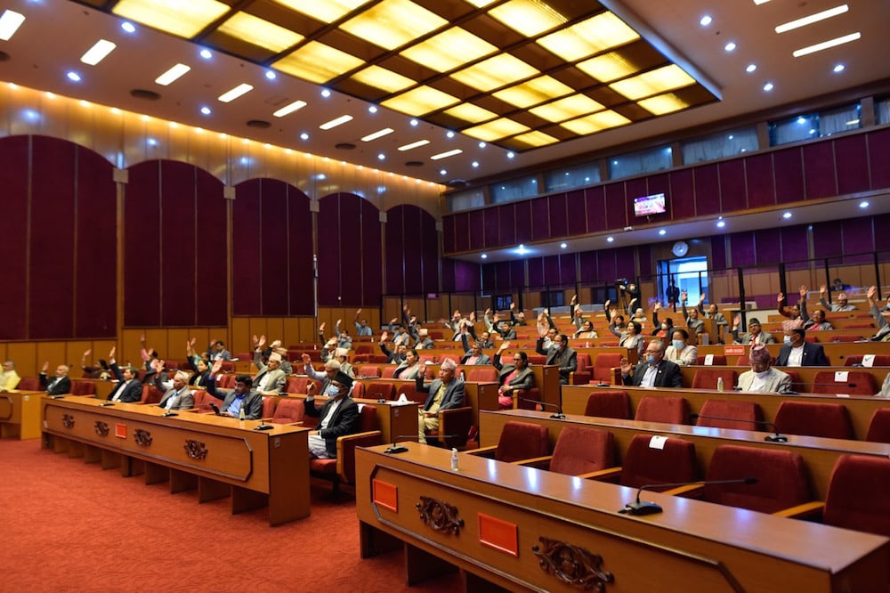 Members of the National Assembly gesture as they vote on a Constitution Amendment bill, Kathmandu, Nepal, 18 June 2020, Narayan Maharjan/NurPhoto via Getty Images