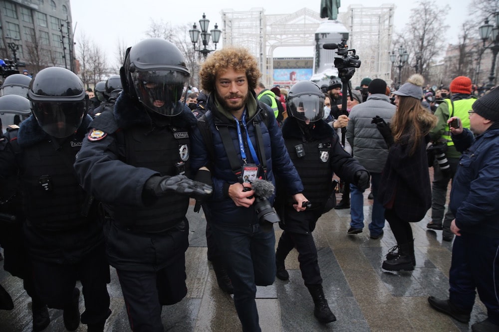 Police officers detain a blogger and journalist (C) during the protest against the jailing of opposition leader Alexei Navalny, in Central Moscow, Russia, 23 January 2021, Mikhail Svetlov/Getty Images