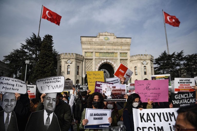 Istanbul University's students hold posters of Boğaziçi University rector Melih Bulu (L) and their own rector, during a protest in solidarity with Boğaziçi, in Istanbul, Turkey, 11 January 2021, OZAN KOSE/AFP via Getty Images