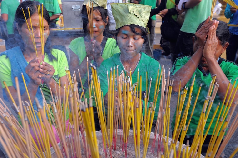 Cambodian villagers pray during a rally against the destruction of the Prey Lang forest, in front of the Royal Palace in Phnom Penh, Cambodia, 18 August 2011, TANG CHHIN SOTHY/AFP via Getty Images