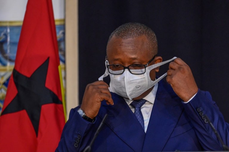 The President of the Republic of Guinea-Bissau, Umaro Sissoco Embaló, takes off his protective mask before delivering remarks during an official visit in Lisbon, Portugal, 8 October 2020, Horacio Villalobos/Contributor, Corbis via Getty Images