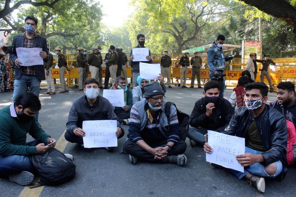 A group of journalists protest against the arrest of their colleague freelance journalist Mandeep Punia, in front of police headquarters, at Jai Singh Marg, New Delhi, India, 31 January 2021, Mayank Makhija/NurPhoto via Getty Images