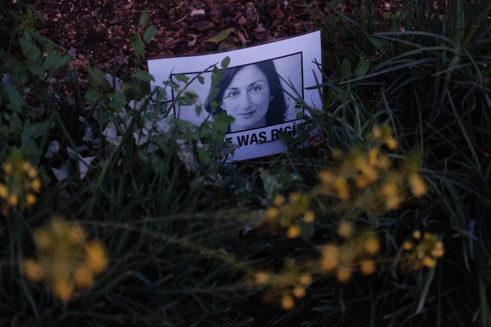 A picture of assassinated journalist Daphne Caruana Galizia at the protest memorial dedicated to her on the third anniversary of her murder, in Valletta, Malta, 16 October 2020, Joanna Demarco/Getty Images