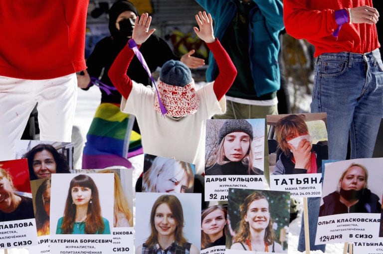 Photographs of women rights defenders and journalists imprisoned since the August 2020 presidential elections are displayed during a flash mob protesting the crackdown, Minsk, Belarus, 14 February 2012, STRINGER/AFP via Getty Images