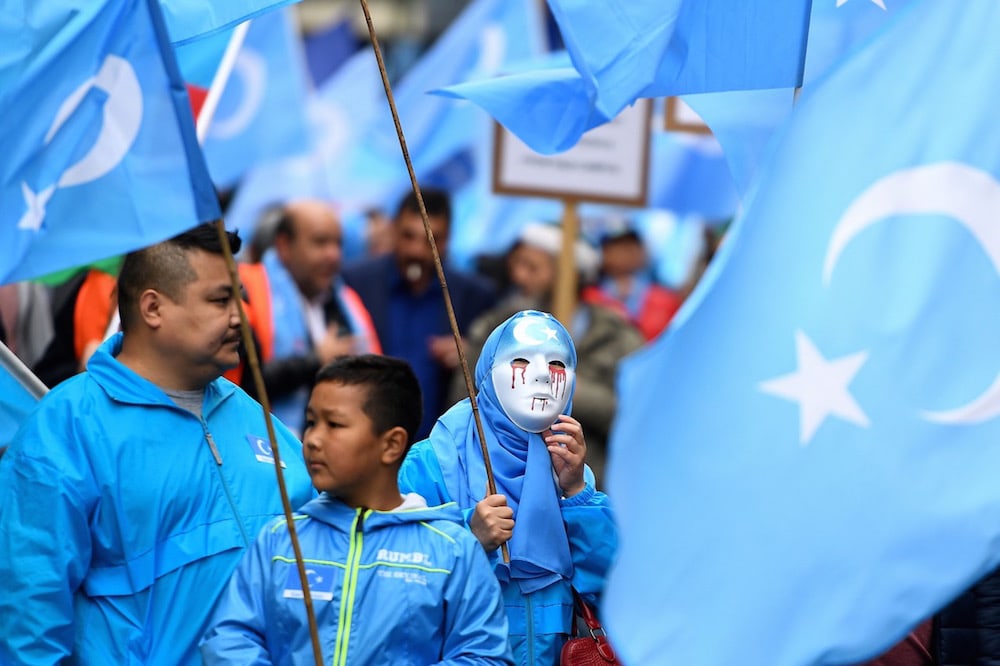 Ethnic Uighurs take part in a march in Brussels, Belgium, 27 April 2018, to urge the European Union to call on China to respect human rights in Xinjiang and close the "re-education centers" where some Uighurs are detained, EMMANUEL DUNAND/AFP via Getty Images
