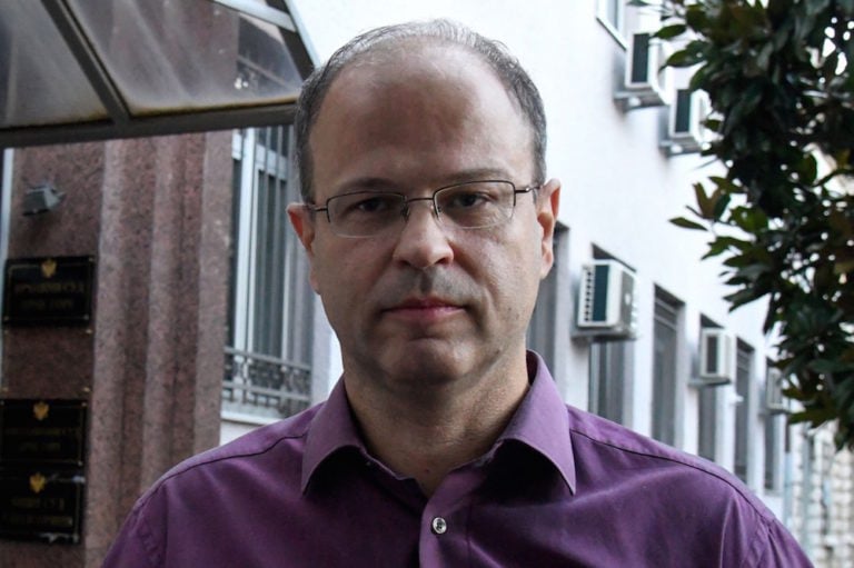 Investigative reporter Jovo Martinović poses for a photo in front of a court in Podgorica, Montenegro, 8 October 2020, SAVO PRELEVIC/AFP via Getty Images