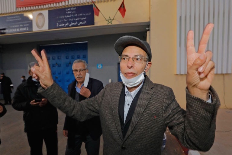 French-Moroccan journalist and rights activist Maâti Monjib (C), who had been on hunger strike, gestures upon his release from El Arjate prison near the capital Rabat, 23 March 2021, STR/AFP via Getty Images