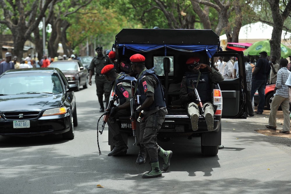 Nigerian security operatives during gubernatorial elections in Bauchi, the capital of Bauchi state, nothern Nigeria, 28 April 2011, TONY KARUMBA/AFP via Getty Images