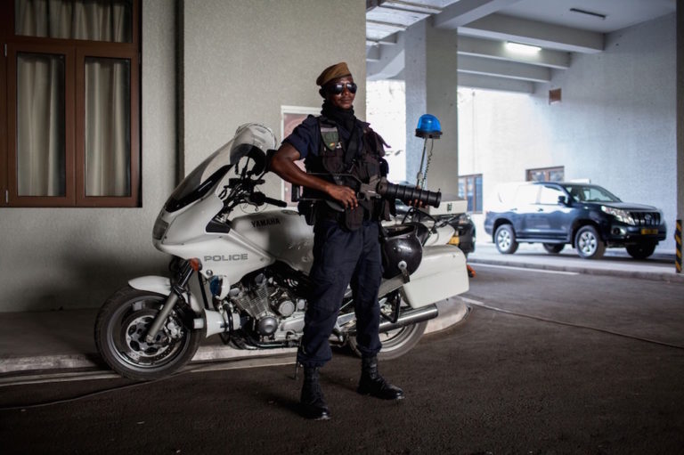 A policeman stands guard at a stadium in Brazzaville, Republic of Congo, 27 March 2016, FLORIAN PLAUCHEUR/AFP via Getty Images