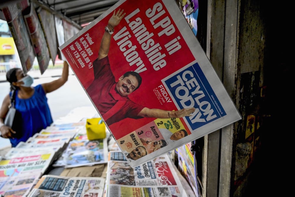 Newspapers covering the results of Sri Lanka's parliamentary elections are sold at a stall in Colombo, 7 August 2020, ISHARA S. KODIKARA/AFP via Getty Images