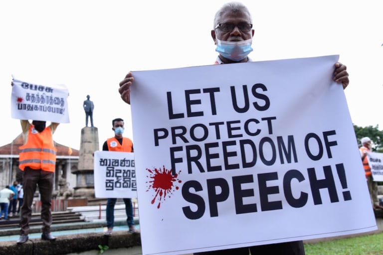 Opposition supporters hold placards during a protest against the targeting of individuals being arrested for hate speech against President Gotabaya Rajapaksa, near Colombo, Sri Lanka, 13 January 2021, Akila Jayawardana/NurPhoto