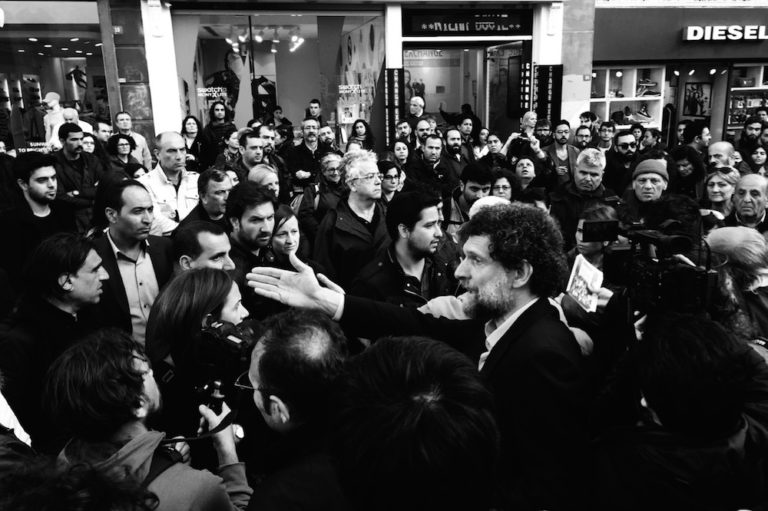 Osman Kavala (C) at the Armenian Genocide centennial commemoration near Taksim Square, Istanbul, Turkey, 24 April 2015, Photo: Rupen Janbazian, Own work, CC BY-SA 4.0, https://commons.wikimedia.org/w/index.php?curid=78366735