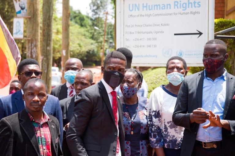 Opposition leader Robert Kyagulanyi, aka Bobi Wine, and supporters outside the UN Human Rights Office office in Kampala, as journalists are assaulted by Uganda Military Police, 17 February 2021, BADRU KATUMBA/AFP via Getty Images