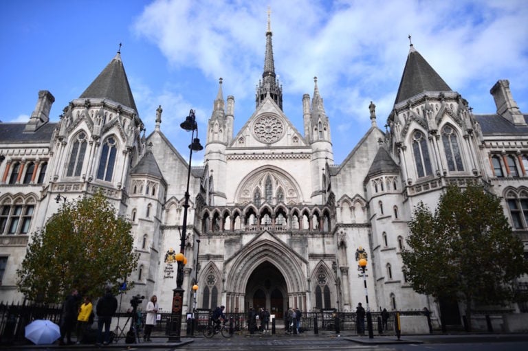 Media gather outside the Royal Courts of Justice where the High Court is located, London, United Kingdom, 2 November 2020, BEN STANSALL/AFP via Getty Images