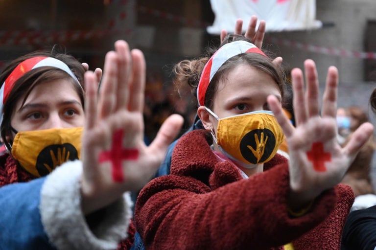 Students raise their hands to show a red cross protest symbol, at the end of a campus blockade at the University of Theatre and Film Arts (SZFE) in Budapest, Hungary, 11 November 2020, ATTILA KISBENEDEK/AFP via Getty Images