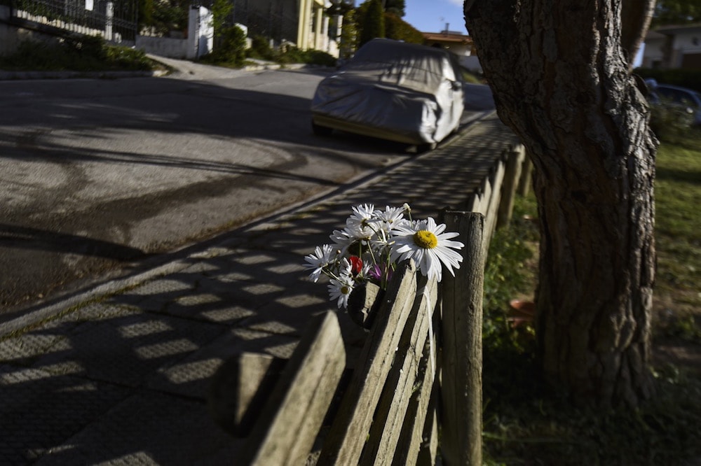 Flowers are placed at the site where journalist Giorgos Karaivaz was murdered in Alimos, on the southern coast of Attica, Greece, 9 April 2021, Dimitris Lampropoulos/Anadolu Agency via Getty Images