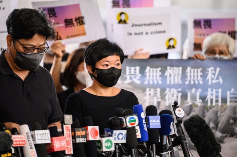 Radio Television Hong Kong (RTHK) producer Bao Choy Yuk-ling (C) speaks to the press at the West Kowloon Courts building, in Hong Kong, 22 April 2021, ANTHONY WALLACE/AFP via Getty Images