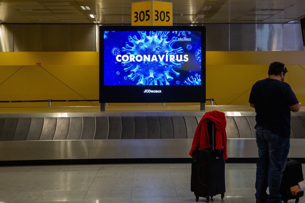 Messages about Covid-19 greet passengers landing at Guarulhos International Airport, São Paulo, Brazil, 15 March 2020, Carol Coelho/Getty Images