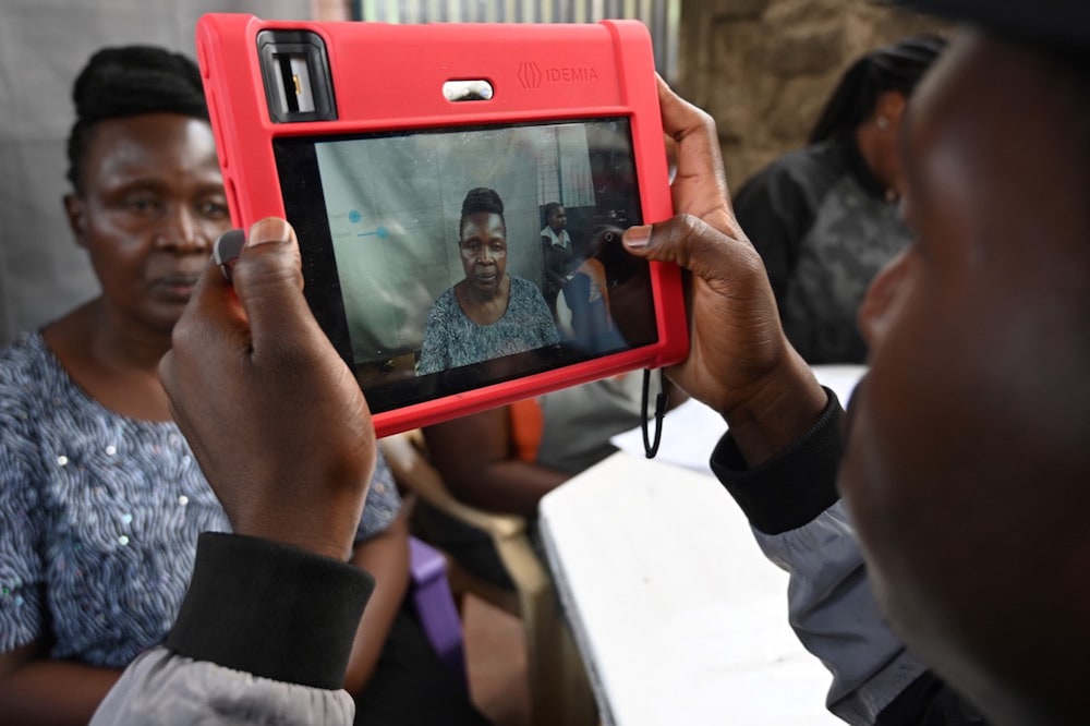 A biometric camera is used to register a Kenyan woman in a National Integrated Identity Management system, via which citizens can access government services. Nairobi, 17 May 2019, SIMON MAINA/AFP via Getty Images