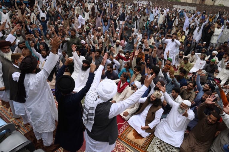 Lahore, Pakistan, 16 April 2021. Supporters of the Islamist political party Tehreek-e-Labbaik Pakistan (TLP) block a street during a protest after their leader was detained following his calls for the expulsion of the French ambassador, ARIF ALI/AFP via Getty Images