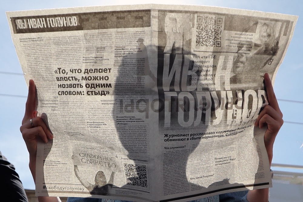 People hold newspapers during a rally in support of free speech and journalist Ivan Golunov, of the online news portal Meduza, who was facing an investigation at the time, St Petersburg, Russia, 12 June 2019, Peter KovalevTASS via Getty Images