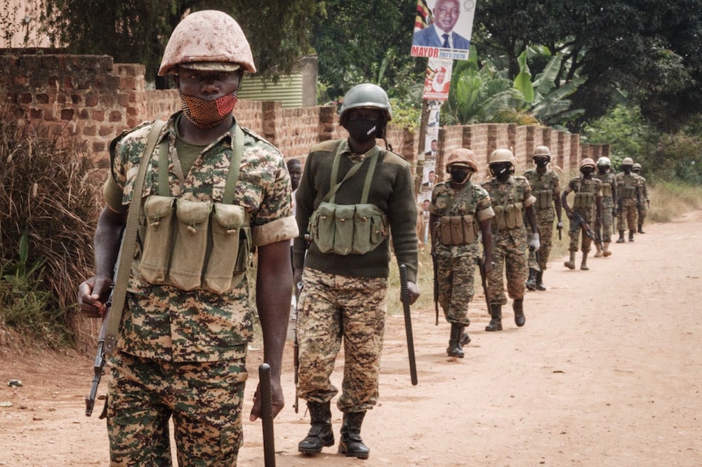 Soldiers patrol in Magere, Uganda, 18 January 2021, YASUYOSHI CHIBA/AFP via Getty Images