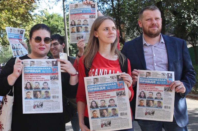 Journalists hold issues of the "Komsomolskaya Pravda" newspaper as they welcome their colleagues who were being released from a temporary detention facility, Minsk, Belarus, 4 September 2020, Natalia FedosenkoTASS via Getty Images