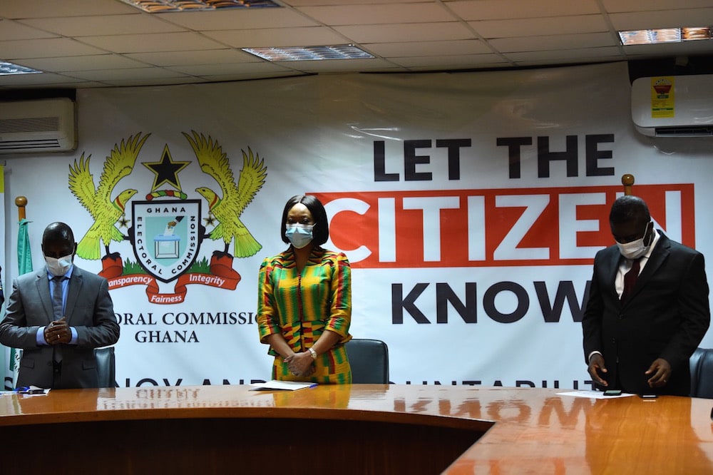 The Chairperson of the Electoral Commission (C) and electoral officials stand for the national anthem before announcing the results of the presidential election, in Accra, Ghana, 9 December 2020, PIUS UTOMI EKPEI/AFP via Getty Images