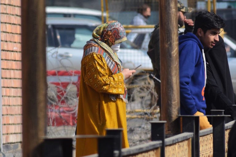 A woman uses her cellphone in Srinagar, 6 February 2021; at that time the Indian government restored high speed 4G internet services in Jammu and Kashmir after 18 months, Faisal Khan/NurPhoto