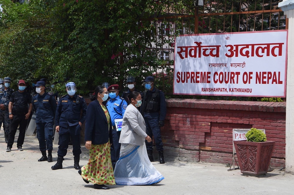 Parliamentarians arrive at the Supreme Court to file a writ petition against the president's decision to dissolve the parliament for the second time, Kathmandu, Nepal, 24 May 2021, PRAKASH MATHEMA/AFP via Getty Images