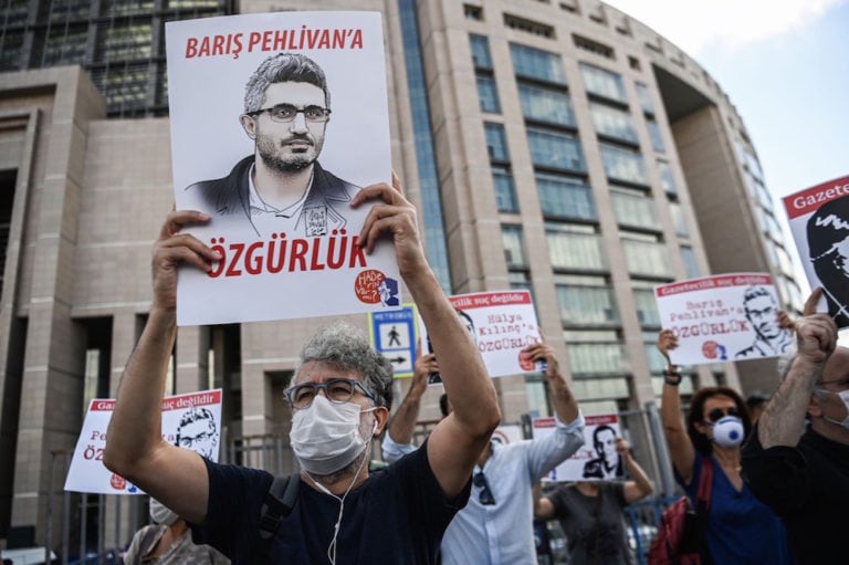 Demonstrators hold posters of jailed journalists while calling for their release, in front of a courthouse in Istanbul, Turkey, 9 September 2020, OZAN KOSE/AFP via Getty Images