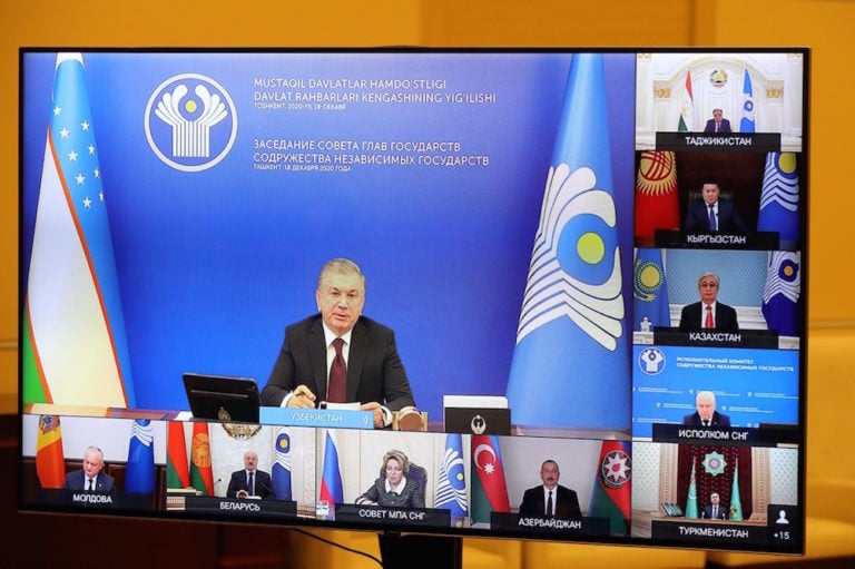 Uzbekistan's President Shavkat Mirziyoyev (on screen) takes part in a video conference meeting of the Council of Heads of State of the Commonwealth of Independent States (CIS), 18 December 2020, Mikhail Klimentyev/Russian Presidential Press and Information Office/TASS via Getty Images