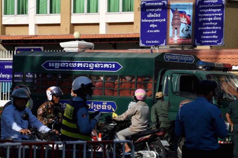 Jailed opposition members and activists sit in a prison truck in front of the Phnom Penh municipal court in Phnom Penh, Cambodia, 14 January 2021, TANG CHHIN SOTHY/AFP via Getty Images