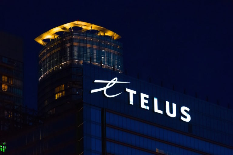 A sign with the Telus logo on a downtown building, Toronto, Canada, 18 June 2016, Roberto Machado Noa/LightRocket via Getty Images
