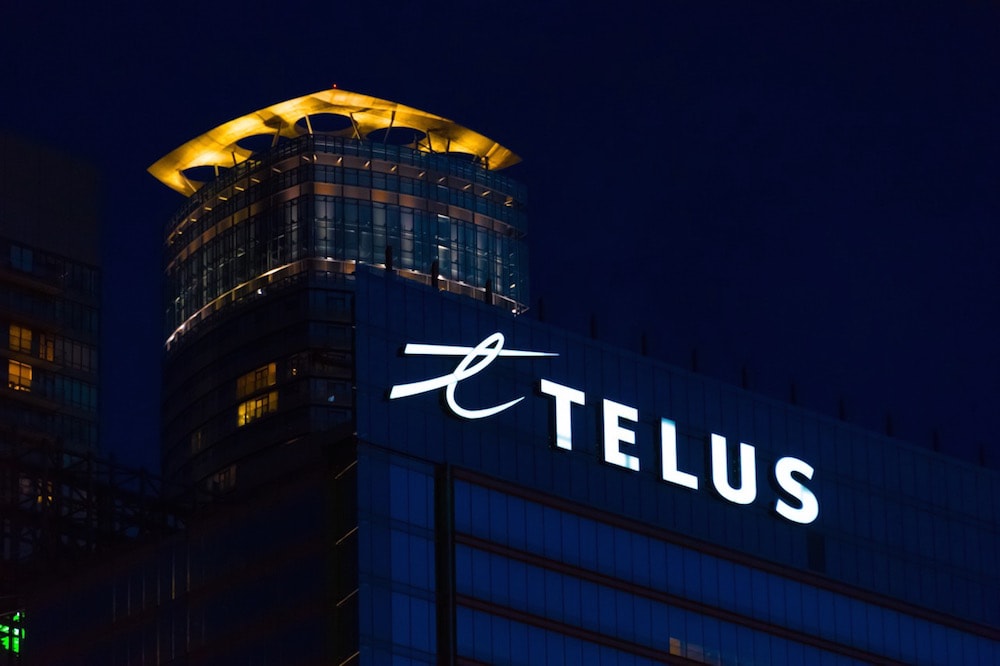 A sign with the Telus logo on a downtown building, Toronto, Canada, 18 June 2016, Roberto Machado Noa/LightRocket via Getty Images