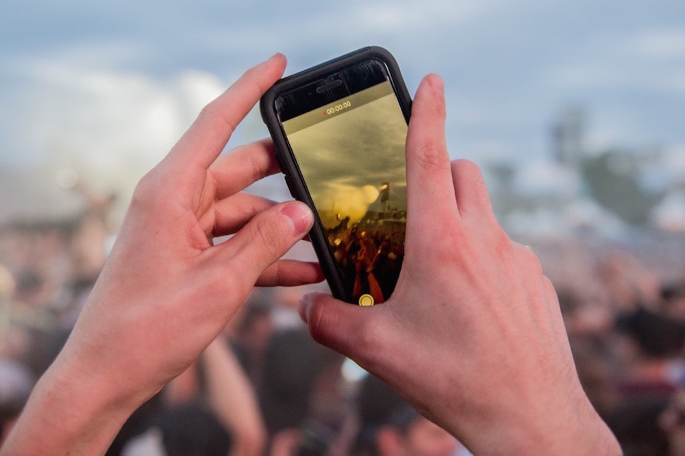 A fan records a performance during a music festival, in Quebec City, Canada, 11 July 2018, Ollie Millington/Redferns