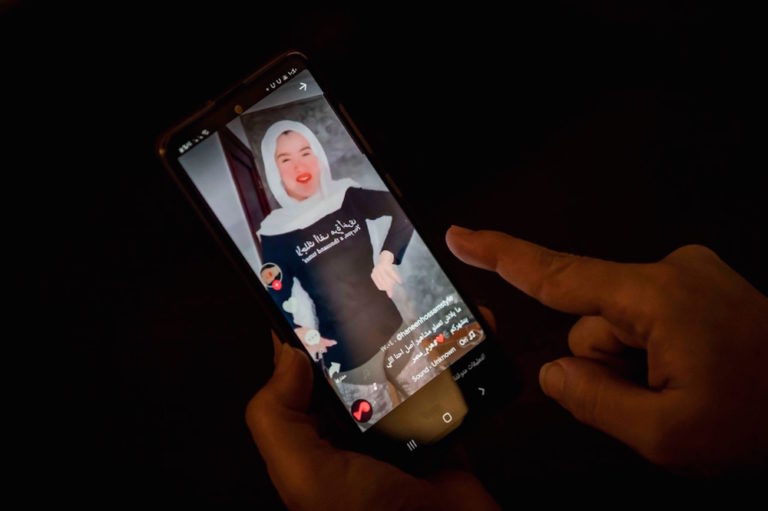 A woman watches a video of Egyptian influencer Haneen Hossam on the video-sharing app TikTok, Cairo, Egypt, 28 July 2020, KHALED DESOUKI/AFP via Getty Images