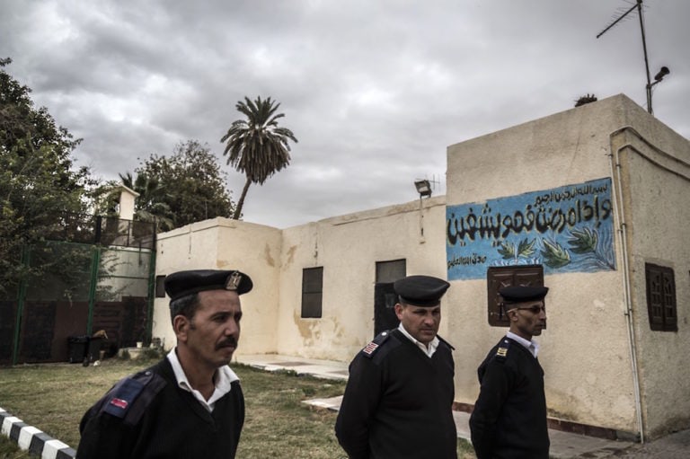 A picture taken during a guided tour organised by Egypt's State Information Service, shows policemen standing guard in front of the Tora prison clinic, on the outskirts of Cairo, 11 February 2020. KHALED DESOUKI/AFP via Getty Images