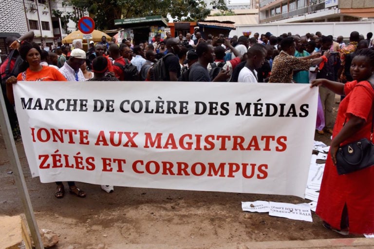Journalists take part in a rally to demand the release of an arrested colleague, in Conakry, Guinea, 2 April 2019, CELLOU BINANI/AFP via Getty Images