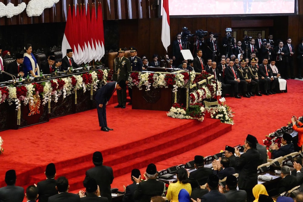 President Joko Widodo bows to the members of parliament during his inauguration, at the Parliament building in Jakarta, Indonesia, 20 October 2019, Anton Raharjo/Anadolu Agency via Getty Images