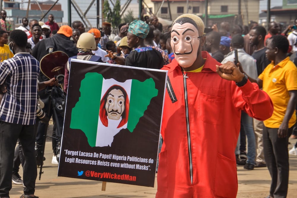 A protester wears a mask during an anti-government protest against bad governance and insecurity, as well as the Twitter ban, in the Ojota district of Lagos, Nigeria, 12 June 2021, Olukayode Jaiyeola/NurPhoto via Getty Images